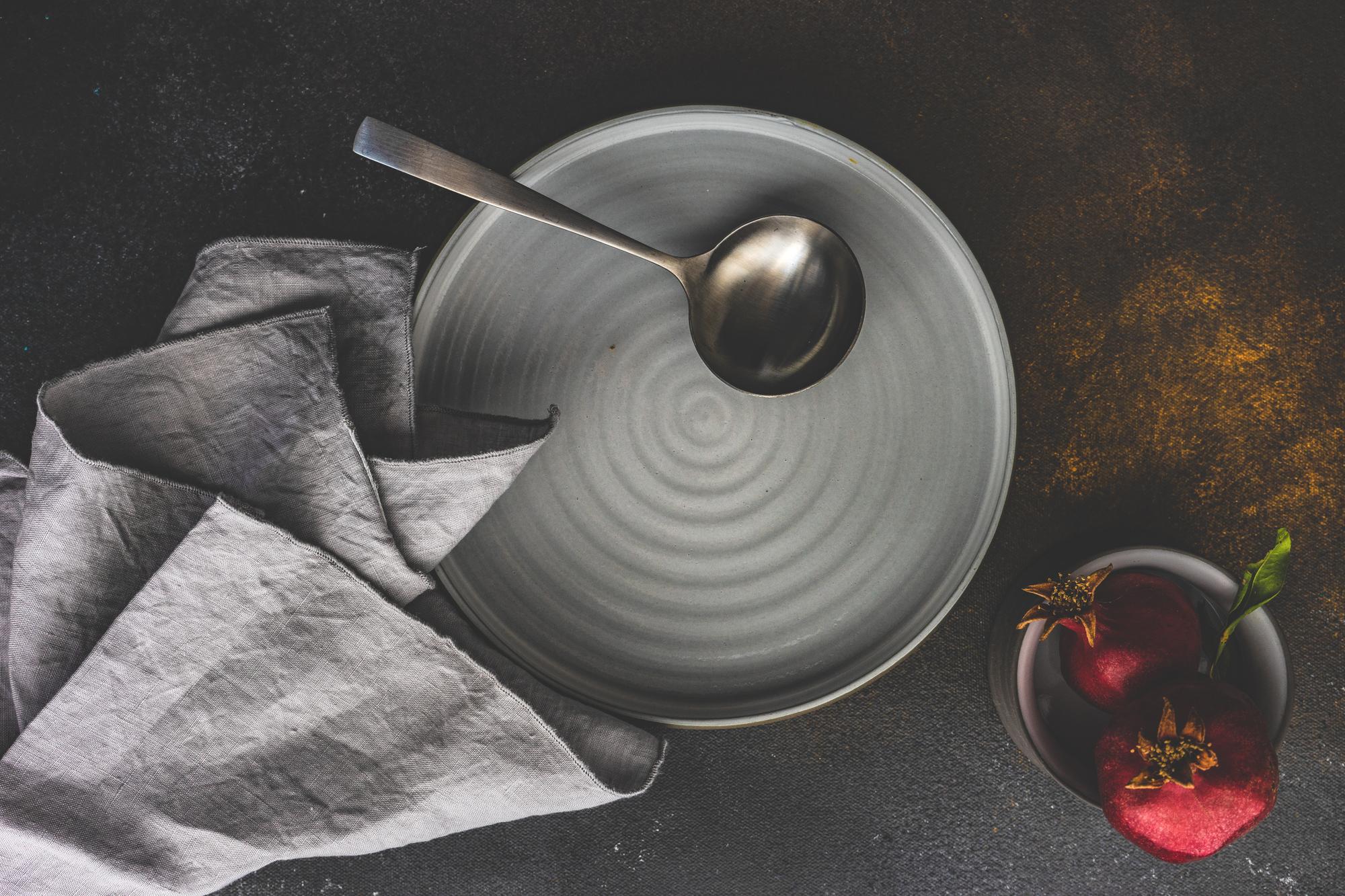 Close-up of artisan kitchen tools and plated food